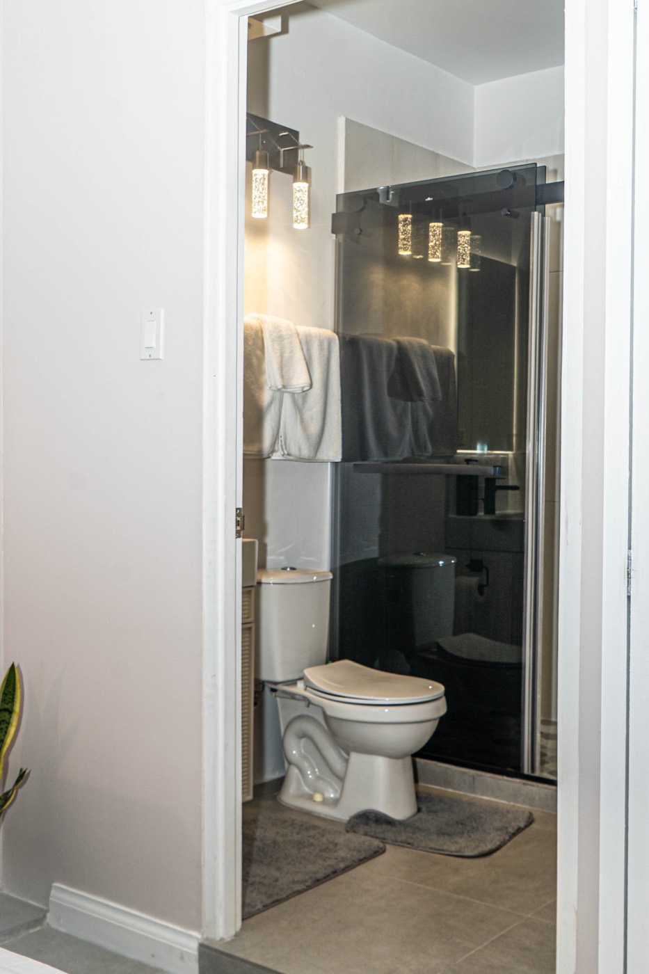 Bathroom with glass shower enclosure and fresh towels