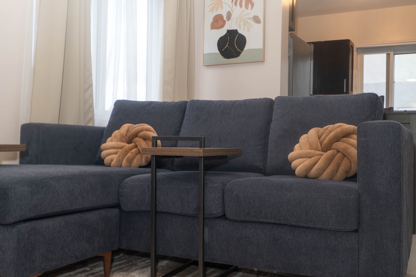 Navy sectional sofa with knot cushions