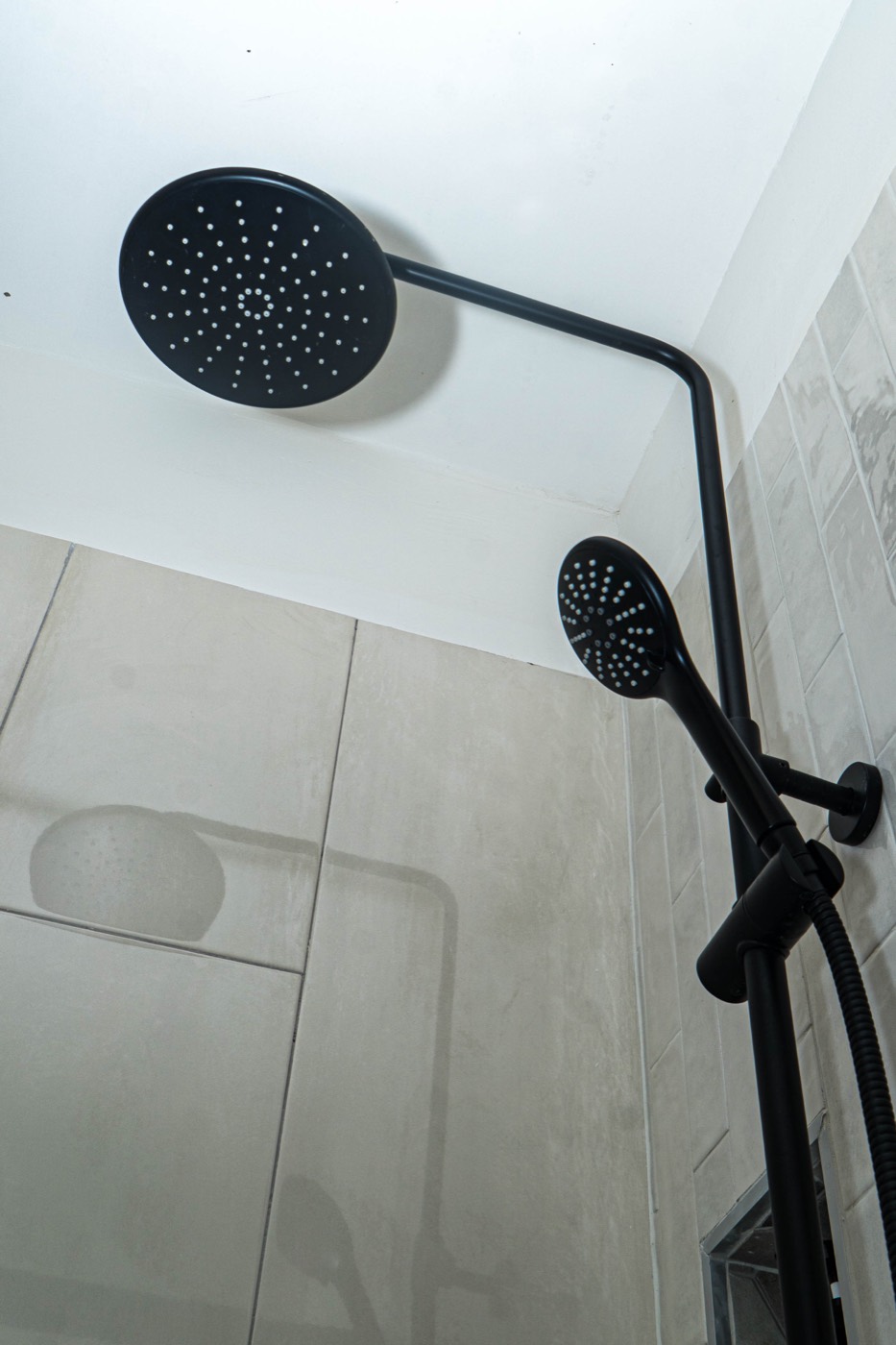 Matte black rain shower head and handheld sprayer